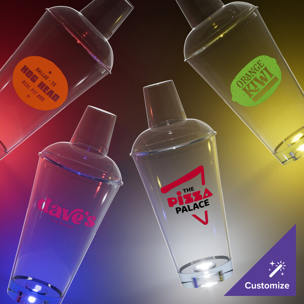 A group of plastic shakers with colorful labels on a table.