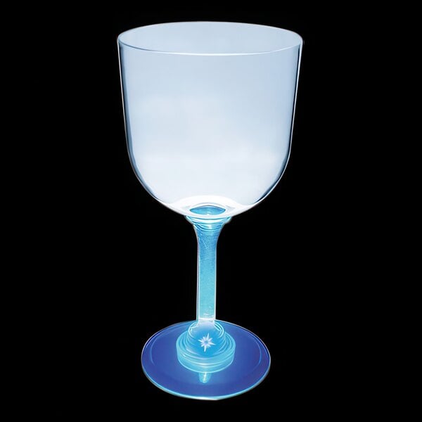 A clear plastic goblet with a blue base.