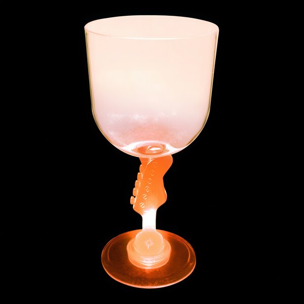 A close-up of a 14 oz. plastic guitar goblet with an orange LED light inside.