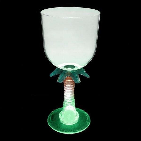 A clear plastic goblet with a palm tree stem and a green LED light.