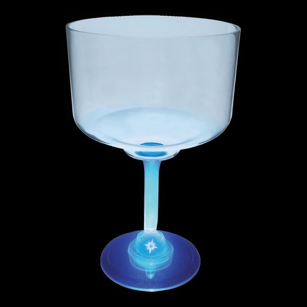 A clear plastic margarita cup with a blue base.