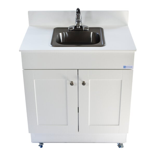 A white Monsam portable sink on a white wood cabinet.