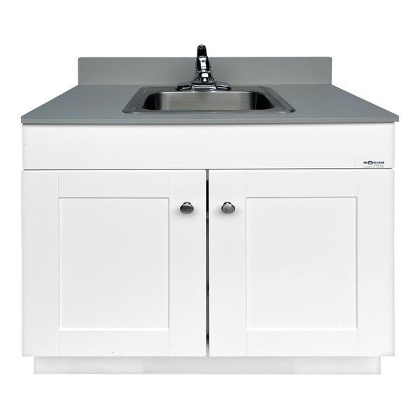 A white wood cabinet with a white Monsam portable sink on top.
