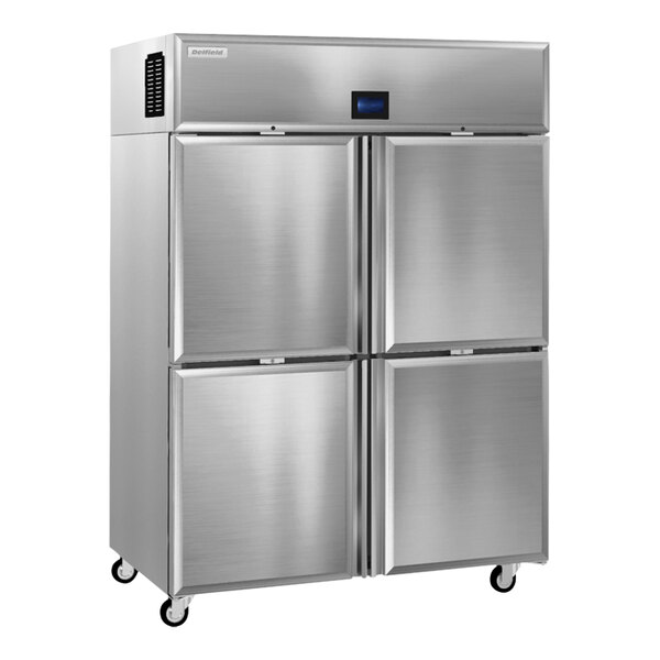 A silver stainless steel Delfield reach-in refrigerator with four half doors.