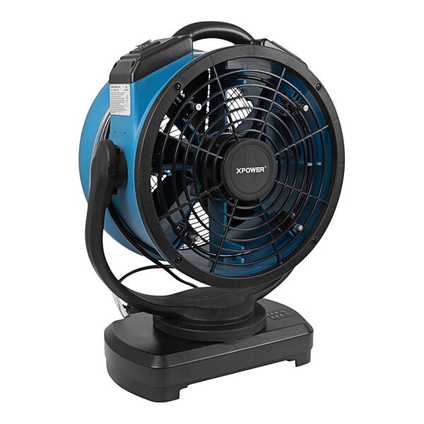 An XPOWER blue and black cooling misting fan on a stand.