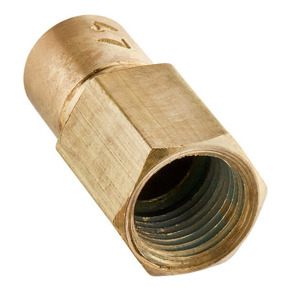 A close-up of a brass pipe threaded with the Avantco Natural Gas Orifice.