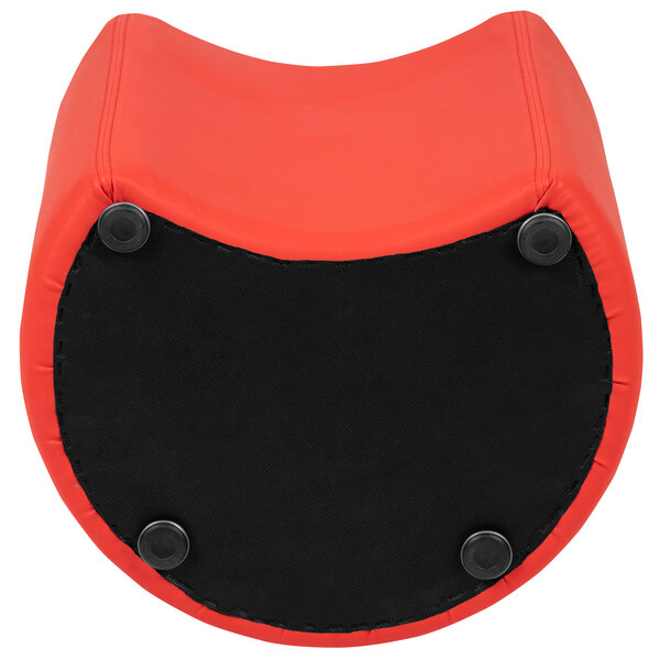 A red and black flexible modular ottoman with a hole in the middle.