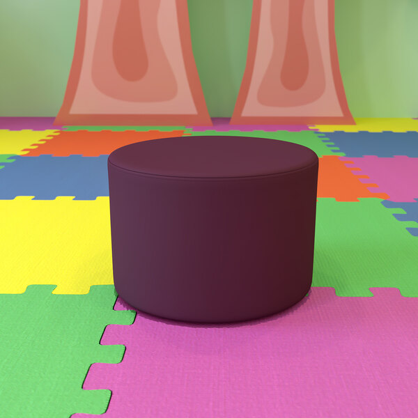 A purple Flash Furniture Nicholas modular ottoman on a colorful floor.
