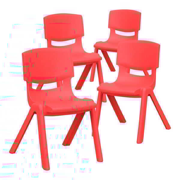 A set of four red plastic Flash Furniture Whitney stackable chairs.