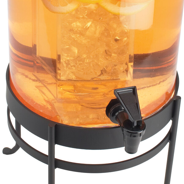 A Cal-Mil black glass beverage dispenser with a drink inside and a metal stand.