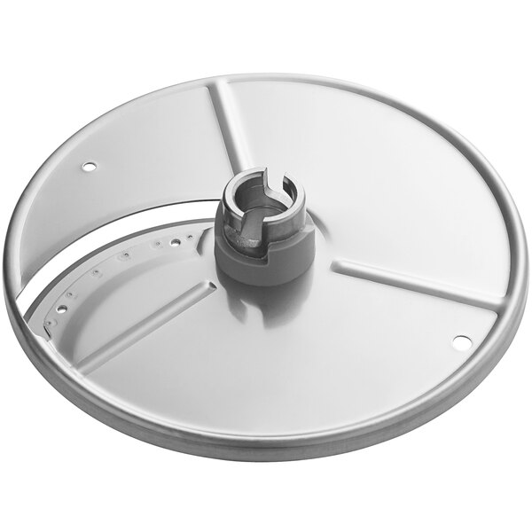 A circular metal plate with a hole in the center and a nut.