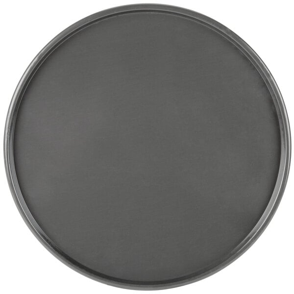 A black round Chicago Metallic pizza pan with a metal rim.