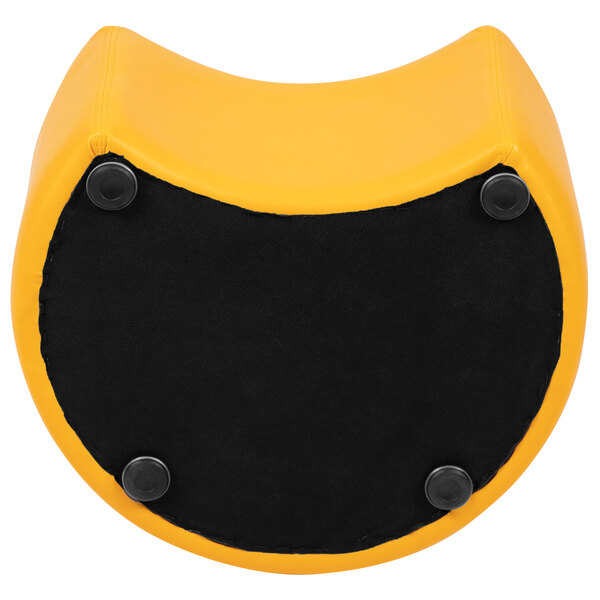 A yellow and black moon-shaped ottoman with a black base.