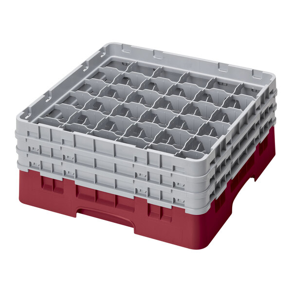 A red and gray Cambro plastic glass rack with several compartments.