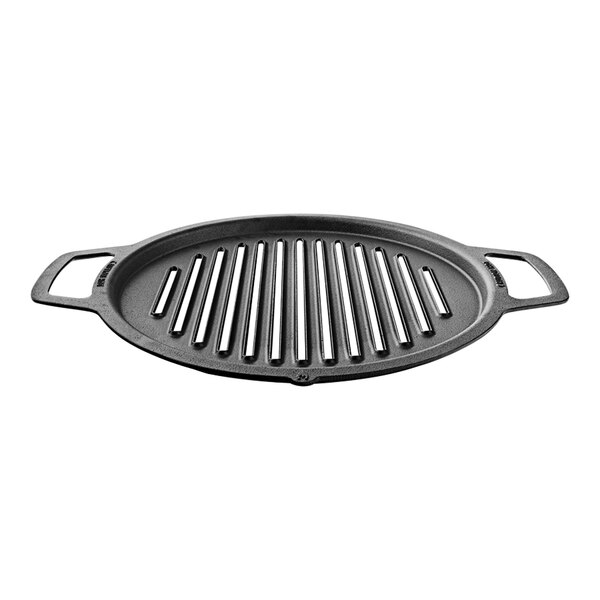 A black round grill pan with long slats on top.