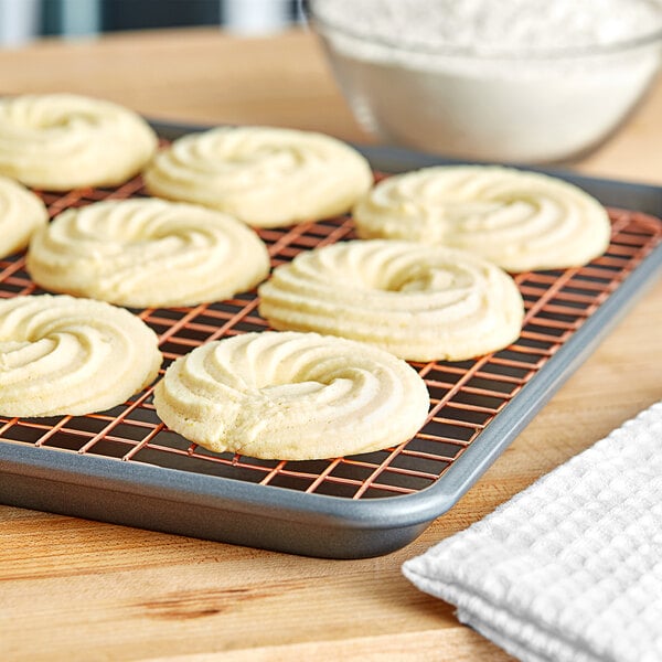 A cooling rack with Caputo Frolla cookies on it.