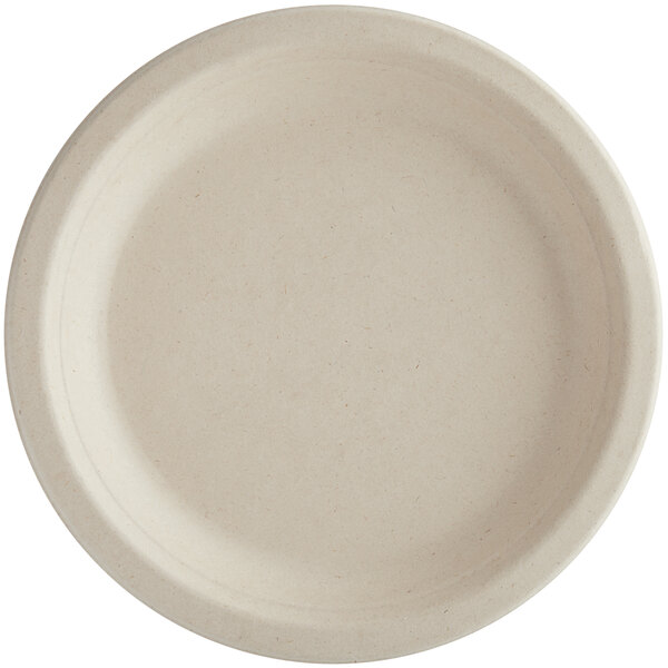 A World Centric round compostable fiber plate with a beige rim.
