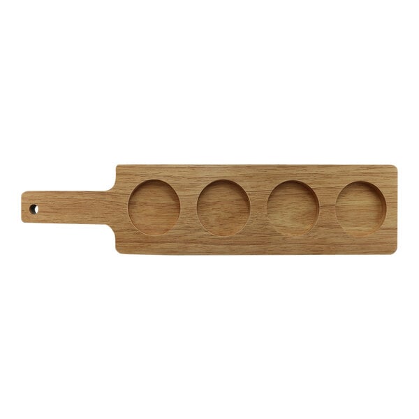 A wooden board with four holes on it.
