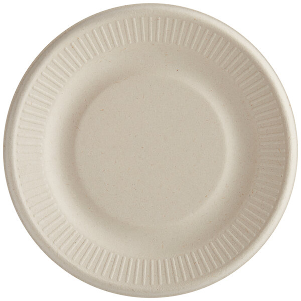 A close-up of a World Centric round compostable fiber plate with a ribbed edge.
