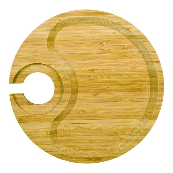 A wooden round bamboo party plate with a hole in the middle.