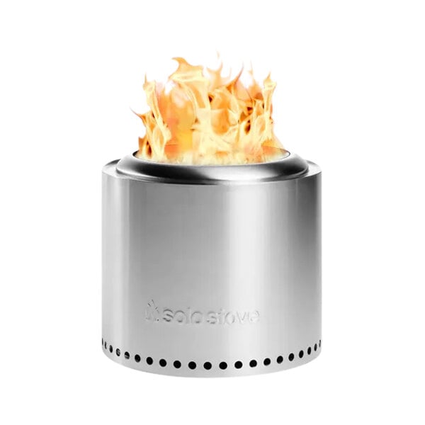 A Solo Stove Ranger 2.0 stainless steel fire pit with a fire burning inside.