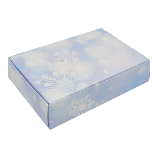 A blue and white 1 1/2 lb. snowflake candy box.