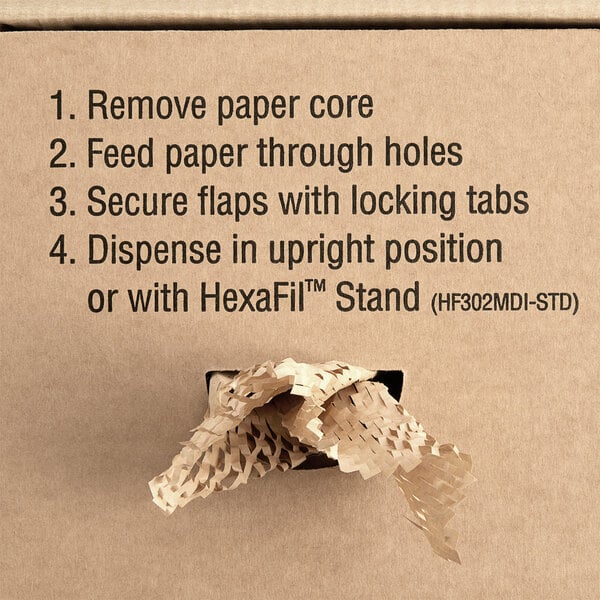 A HexaFil dispenser box with expanding brown void fill paper and a hole in the middle.