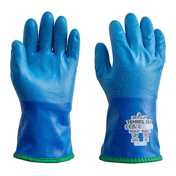 A pair of blue Showa TEMRES thermal insulated gloves with white palms and green trim.