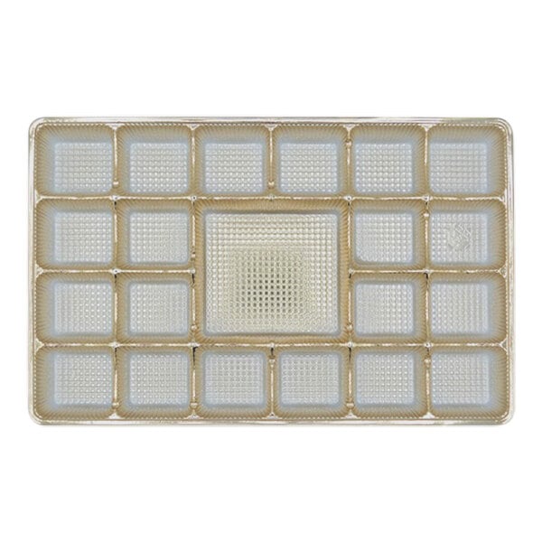 A gold rectangular tray with 21 square cavities.