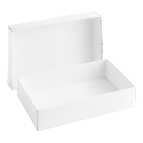 A plain white rectangular two-piece cardboard candy box with the lid partially open.