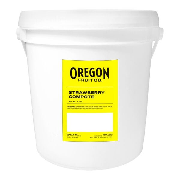 An Oregon Fruit Company white bucket with a yellow and black label.
