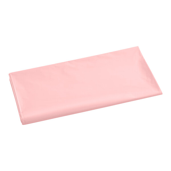 A pink rectangular plastic table cover on a white background.