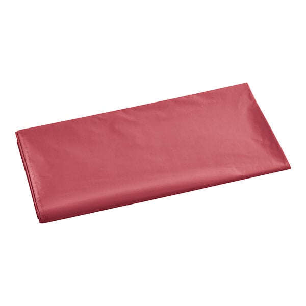 A red plastic bag on a white background with a pink plastic wrapper inside.