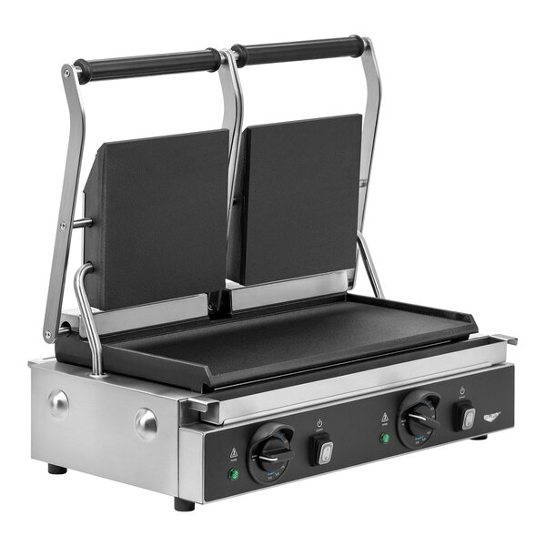 A Vollrath double cast iron panini grill with two smooth plates on it.