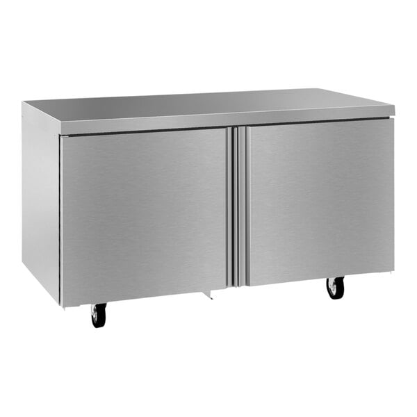 A stainless steel Delfield undercounter refrigerator with two doors on wheels.