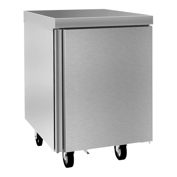 A silver Delfield undercounter refrigerator with wheels.