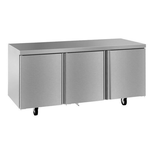 A stainless steel Delfield undercounter refrigerator with three doors.