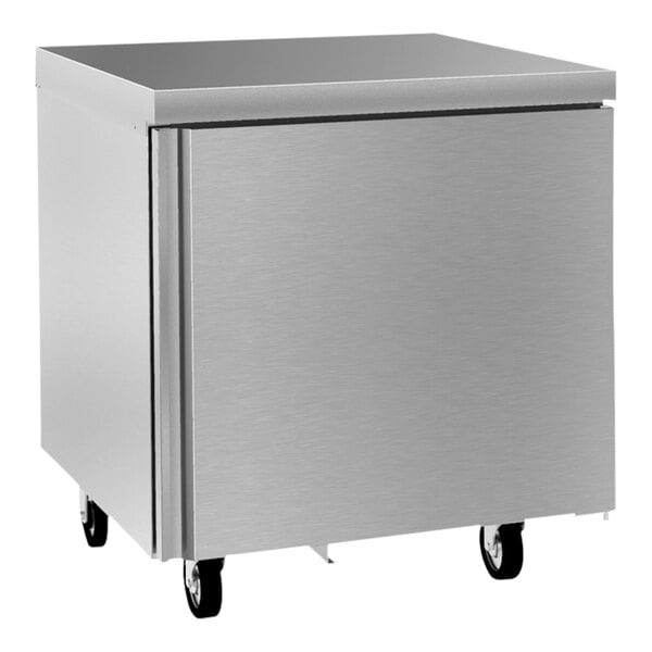 A silver Delfield undercounter refrigerator with wheels.