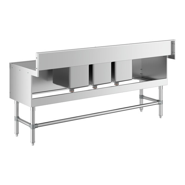 A Regency stainless steel underbar sink with (2) 18" drainboards and three bowls.