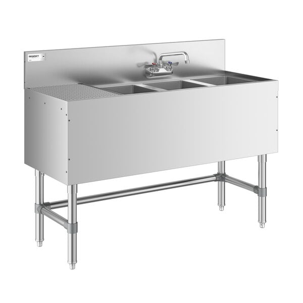 A stainless steel three-compartment sink with a left-side drainboard, backsplash, and faucet, supported by metal legs.