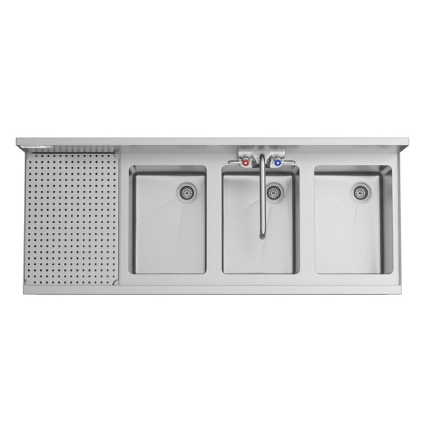 A top-down view of a stainless steel three-bowl sink with a left-side perforated drainboard and a central faucet with hot and cold handles.