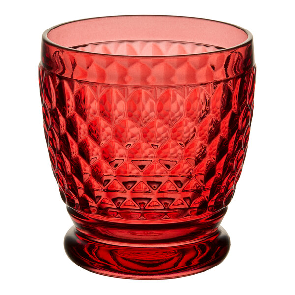 A red textured glass tumbler with a diamond pattern, designed for serving drinks.