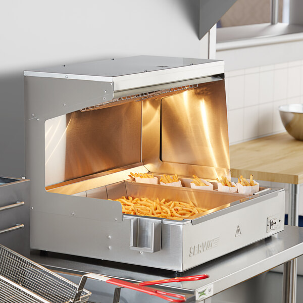 French fries in a ServIt stainless steel fry dump holding station.