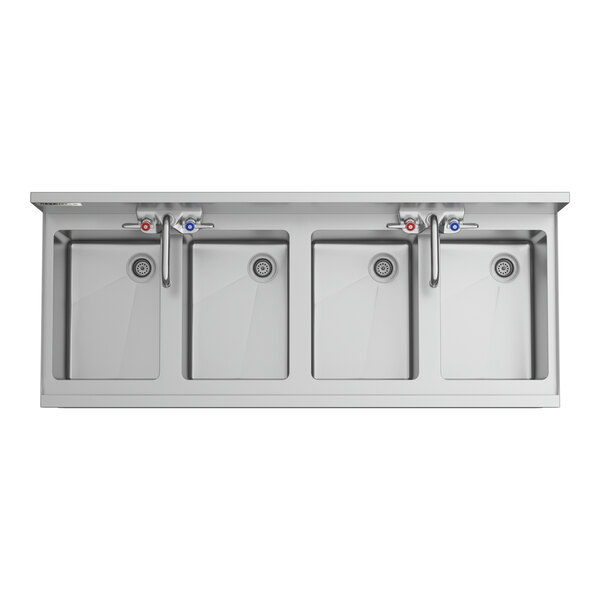 A Regency stainless steel underbar sink with four bowls and two faucets.