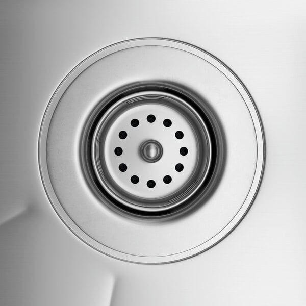 The drain of a Regency Spec Line stainless steel underbar sink.