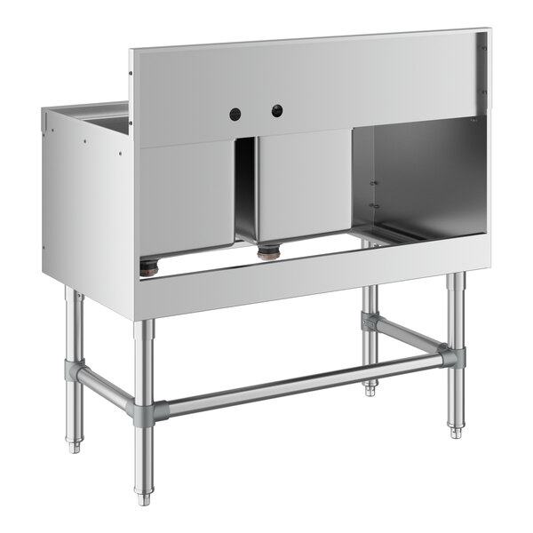 A Regency stainless steel underbar sink with two bowls and a drainboard.