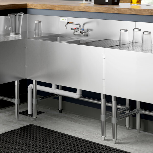 A Regency stainless steel underbar sink with a right drainboard and faucet.