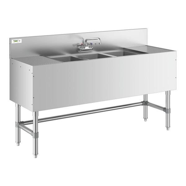 A Regency stainless steel underbar sink with three bowls and two drainboards.
