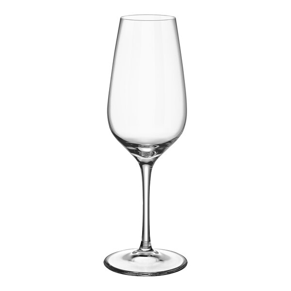 A close up of a clear Villeroy & Boch flute wine glass with a long stem.