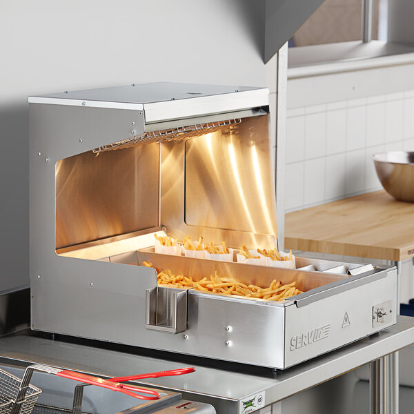 A ServIt stainless steel fry dump holding station with french fries in it.